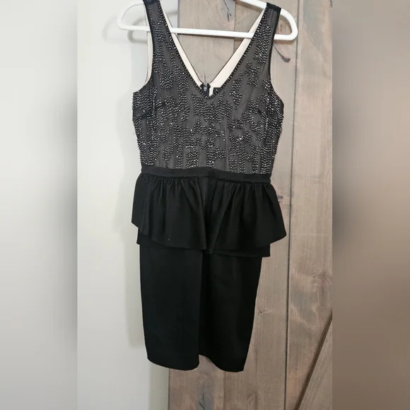 BEBE 90s Beaded top peplum mini dress. Size small - Picture 2 of 11